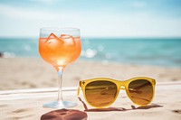 Cocktail sunglasses beach outdoors. AI generated Image by rawpixel.