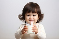 Children girl drinking milk dairy. 