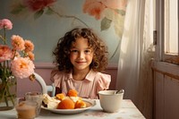 Cute children girl sitting table bowl. 