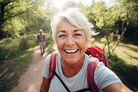 Senior woman laughing outdoors smiling. AI generated Image by rawpixel.