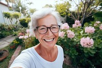 Senior woman portrait outdoors glasses. 