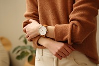 Brown leather watch wristwatch sweater outerwear. 