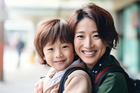 Family cheerful hugging child. 