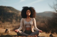 Black woman sports adult yoga. 