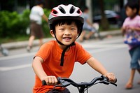 Kid riding bicycle vehicle smiling cycling. 