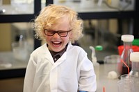 Kid wearing science gown scientist smiling biochemistry. AI generated Image by rawpixel.