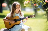 Guitar musician sitting child. 