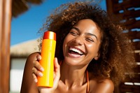 Sunscreen bottle cosmetics laughing. AI generated Image by rawpixel.
