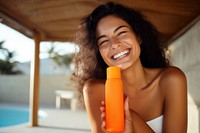 Sunscreen laughing bottle smile. 