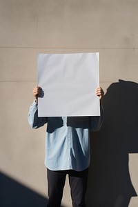 A0 size poster standing holding shadow. AI generated Image by rawpixel.