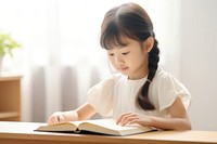 Asian kid girl reading student child. 