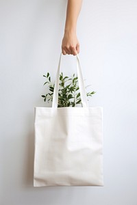 A cotton shopping bag handbag white white background. AI generated Image by rawpixel.