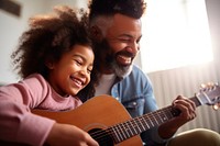 Dad teaching daughter play guitar musician togetherness affectionate. 