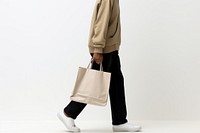 Shopping bag footwear handbag adult. AI generated Image by rawpixel.