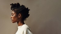 Black woman wearing white sweater portrait adult contemplation. 