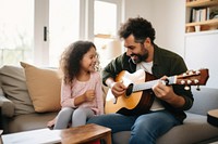 Dad teaching daughter play guitar child musician family. 