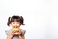 Cute little asian girl enjoy eating a hamburger have fun biting child cute. AI generated Image by rawpixel.