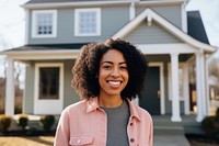 Smiling african american woman standing house adult. 