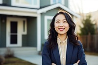 Smiling asian american woman standing adult house. 