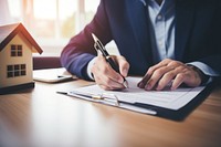 Man signing paper writing pen architecture. 