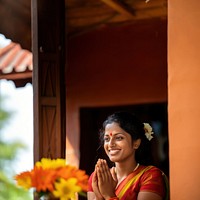 Sri Lankan woman performing a traditional welcoming gesture.  