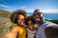 African Family selfie overlooking over the sea. 