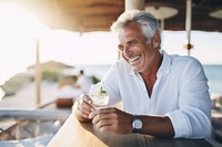 Close up photo of a middle-age men wearing white linen shirt. 