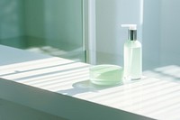 Bathroom bottle green windowsill.