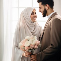 Cropped shot of muslim couple newlywed looking at each other, happy. AI generated Image by rawpixel.