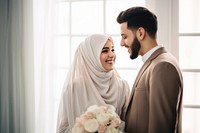 Cropped shot of muslim couple newlywed looking at each other, happy. 