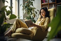 Reading book publication furniture armchair. 