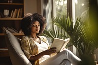 Reading book publication armchair adult. 