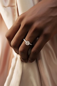 Diamond ring hand jewelry holding. AI generated Image by rawpixel.