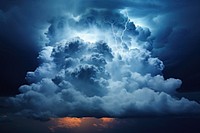 Dark blue cumulus cloud thunderstorm lightning outdoors. 