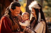 Native American family baby smiling adult. 