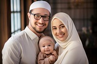 Muslim family baby smiling happy. 