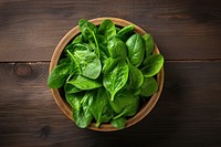 Rustic bowl spinach vegetable plant. 