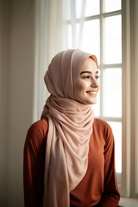 Smiling hijab scarf contemplation. 