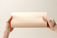Certificate rolling paper hand white background. AI generated Image by rawpixel.