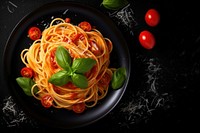 Italian spaghetti pasta plate tomato basil. 