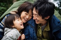 Asian family laughing portrait outdoors. 