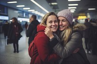 Two friends hugging portrait airport adult. AI generated Image by rawpixel.