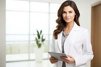 Female doctor holding digital tablet computer stethoscope electronics. AI generated Image by rawpixel.