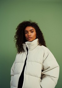 Black woman wearing a white puffer jacket portrait adult photo. 