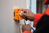 Install a power hand wall electricity. AI generated Image by rawpixel.