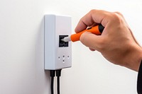 Install a power screwdriver holding hand. AI generated Image by rawpixel.