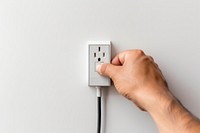 Plug electric holding hand electricity. AI generated Image by rawpixel.