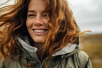 Woman wearing jacket laughing outdoors smile. 