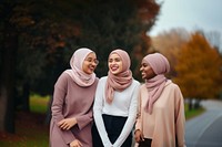 Muslim women laughing outdoors adult. 