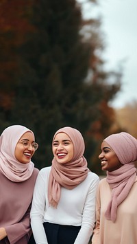 3 muslim women laughing adult scarf. 